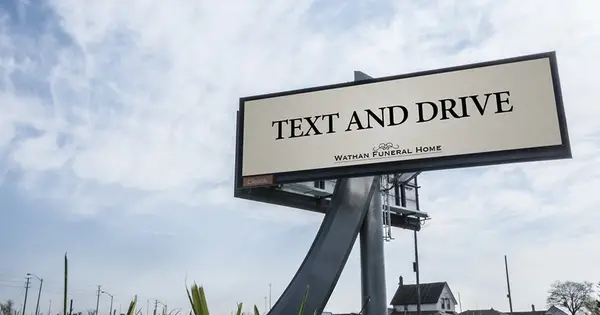 Funeral home ad that only says "Text and Drive."